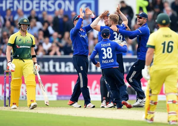 David Willey, who will play for Yorkshire next season, is congratulated after taking the wicket of Australias Steve Smith, left, during yesterdays Royal London One Day International at Headingley (Picture: Martin Rickett/PA Wire).