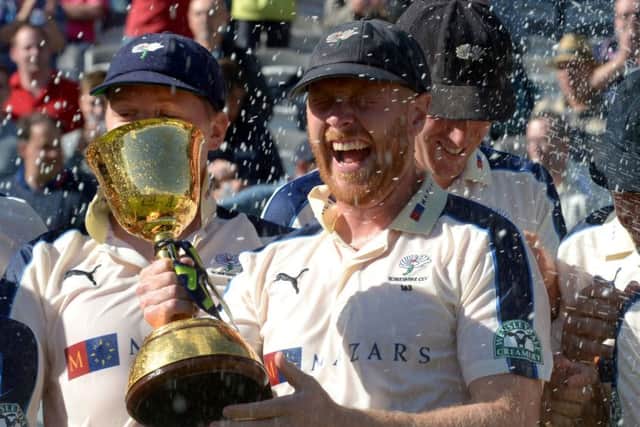 Yorkshire captain Andrew Gale lifts the County Championship trophy.