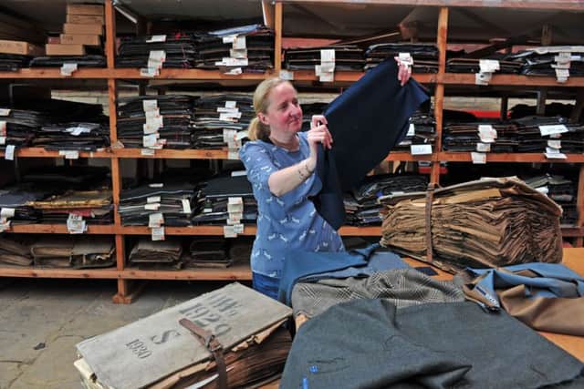 Archive curator Rachel Moaby with the textile collection held at Sunny Bank Mills in Farsley. Picture by Tony Johnson.