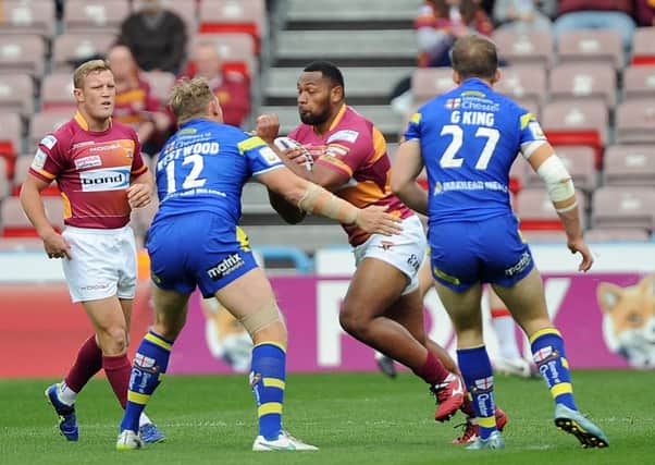 Huddersfield Giants' Ukuma Ta'ai comes up against a staunch Warrington Wolves' defence. Picture: John Rushworth.