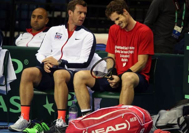 Great Britain coach Leon Smith speaks with Andy Murray during a practice session at the Emirates Arena, Glasgow. Picture: Andrew Milligan/PA.