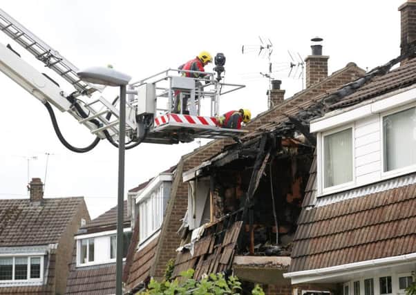 The scene on Valley View Road in Riddings, Derbyshire, where a house was destroyed in a gas explosion earlier today.  September 20,  2015.  Firefighters and an ambulance crew responded to a major gas explosion in a street in Derbyshire yesterday morning (Sun).  See NTI story NTIEXPLOSION.  Emergency services were waiting for structural engineers to determine if it was safe enough for them to tackle the blaze.  Derbyshire Fire and Rescue said they were called to an ÃexplosionÃ in a property in Valley View Road, in Riddings, near Alfreton, Derbs at about 7.33am.  East Midlands Ambulance Service were also at the scene, supporting the firefighters.  Officers suspect there are people inside a damaged property on the street.