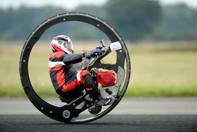 Pictured Kevin Scott, riding his monowheel called 'Warhorse' and breaking another Guinness World Record during the event.