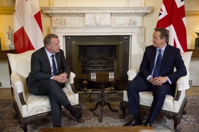 David Cameron  speaks with Danish Prime Minister Lars Loekke Rasmussen.   (AP Photo/Matt Dunham, Pool)