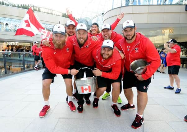 Canadian rugby players sing their national anthem and raise funds for national hero Terry Fox in Leeds. Picture James Hardisty