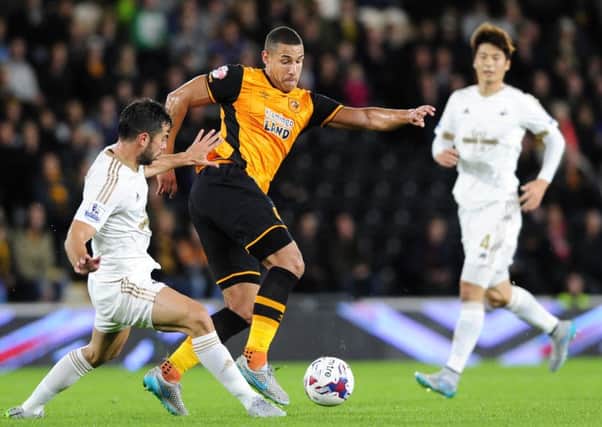 Jake Livermore keeps the ball from Jordi Amat.
 (Picture: Bruce Rollinson)