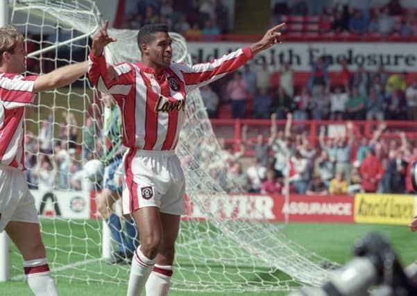 Brian Deane, scoring Sheffield United's first Premiership goal against Manchester United in August 1992.