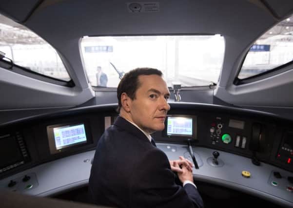 Chancellor George Osborne sit in the cab of one of the 220mph bullet trains,  which run on the thousands of miles of high-speed track China has built in recent years, during a visit to the imposing 14-platform Chengdu East railway station following a meeting with Chinese investors in Chengdu, where he  urged them to bid for a share of £11.8 billion worth of HS2 civil engineering contracts and £24 billion of developments in Northern cities.