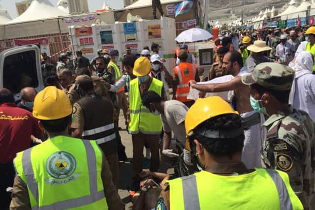 Rescuers respond to the stampede.  Photo: Directorate of the Saudi Civil Defense agency via AP