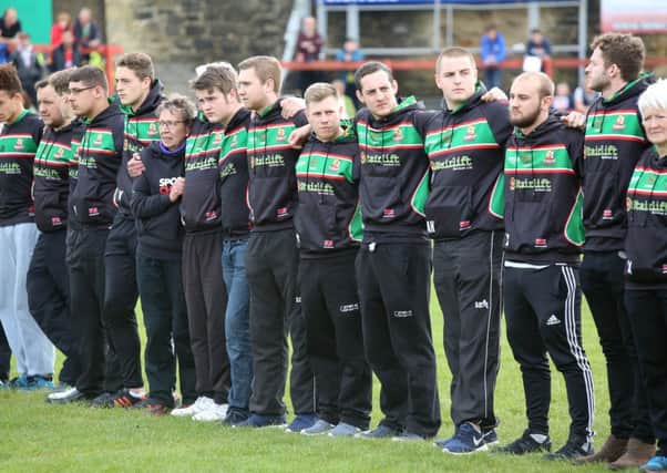 Cougars players and officials during the minute's silence at Cougar Park.