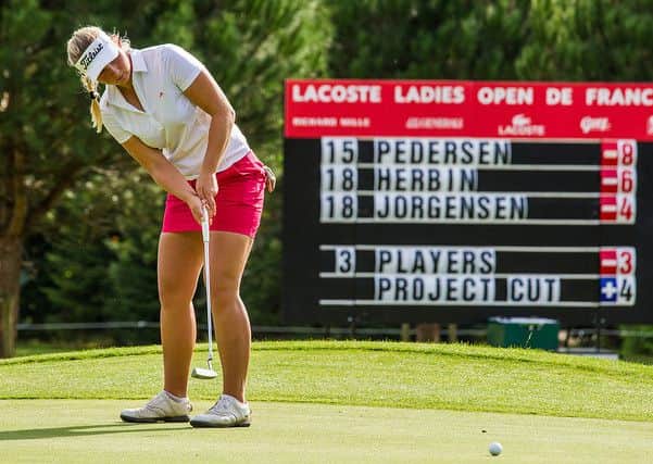 Emily Kristine Pedersen putts on her way to taking the lead at the French Open.