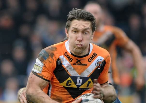 Tigers' Luke Dorn went over for a try against Wigan.