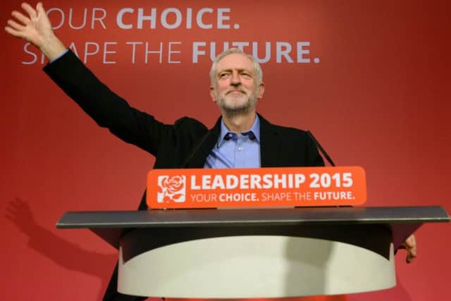 Jeremy Corbyn takes to the stage after he was announced as the Labour Party's new leader at a special conference at the QEII Centre in London. PRESS ASSOCIATION Photo. Picture date: Saturday September 12, 2015. See PA story POLITICS Labour. Photo credit should read: Stefan Rousseau/PA Wire