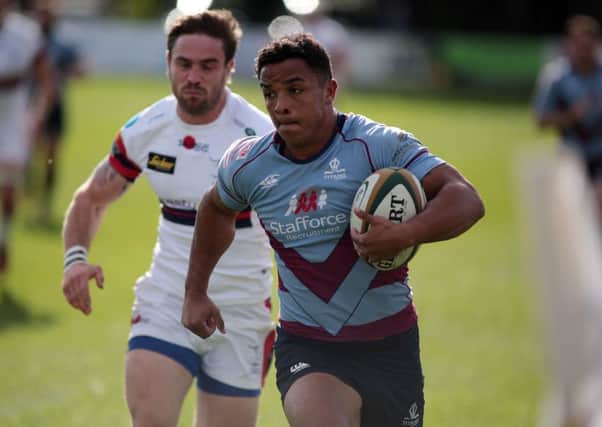 DERBY CLINCHER: Curtis Wilson burts through to score the match-winning try for Rotherham Titans against Doncaster Knights. Picture: Glenn Ashley