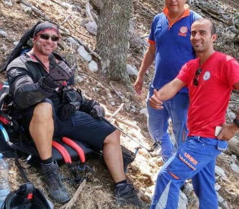 Huddersfield paraglider Sam Cullingworth was caught by a fierce 90mph crosswind in Turkey.
He became tangled in the branches of a cedar tree, preventing him from smashing into the ground, and escaped with just a few cuts. Picture: Cascade