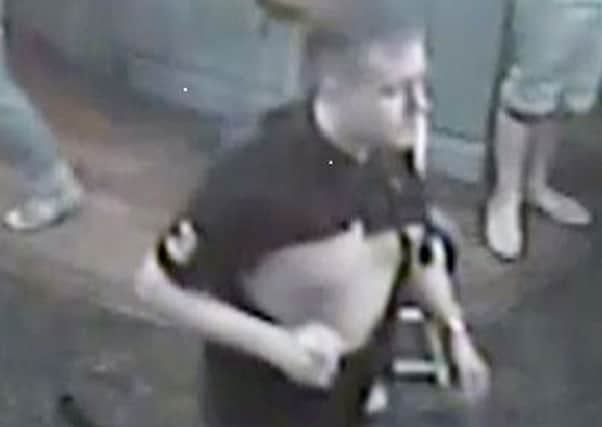 Police have released a CCTV image of a man they want to identify after a woman received serious facial injuries when she was hit by a chair thrown during a fight outside a Leeds pub.