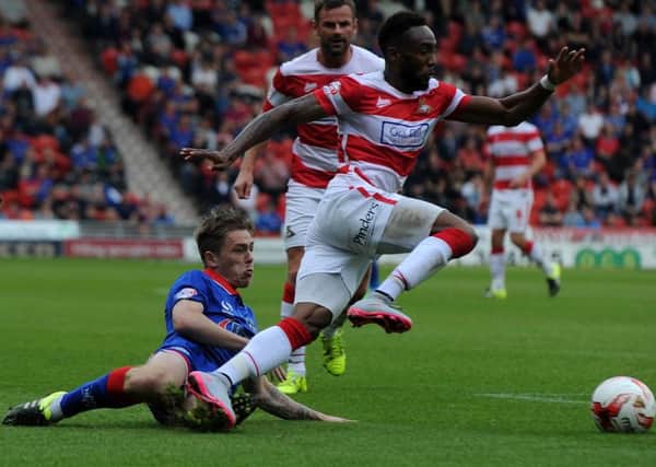 Cedric Evina, pictured in action against Oldham recently, says Doncaster Rovers players have to stand up and be counted (Picture: Andrew Roe).