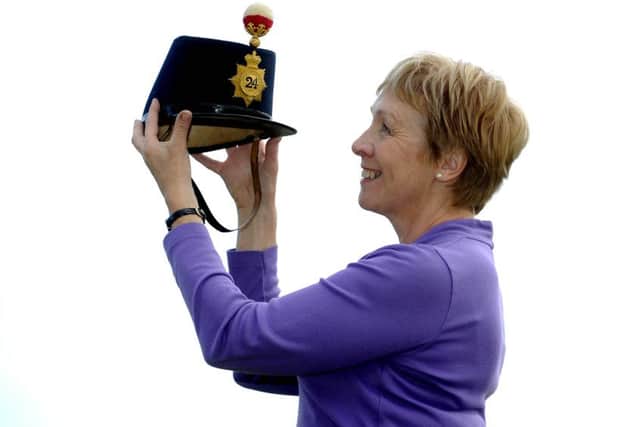 Oonagh Drage holds a Victorian officer's quilted blue cloth Shako of the 24th Regiment of Foot which is due to be sold as part of the Militaria & Ethnographica sale at Tennants Auction Centre in Leyburn tomorrow.