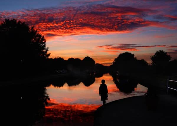 A little girl watches the sunset at Woodlesford Lock, Leeds. PIC: Simon Hulme