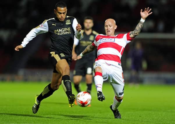 Louis Thompson and Richard Chaplow challenge for the ball. PIC: Bruce Rollinson