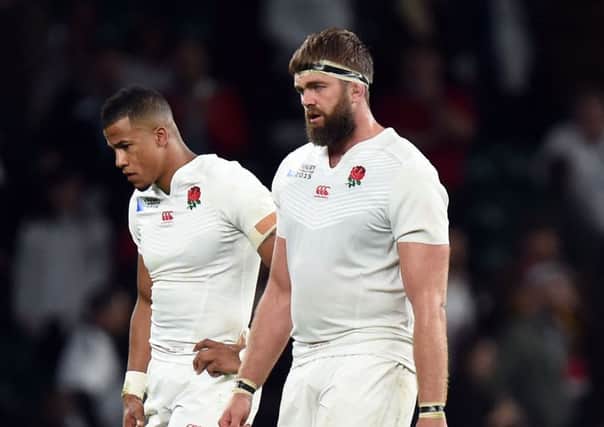 OPPORTUNITY MISSED: Englands Geoff Parling, right, and Anthony Watson look dejected after the World Cup defeat to Wales at Twickenham. Picture: Andrew Matthews/PA