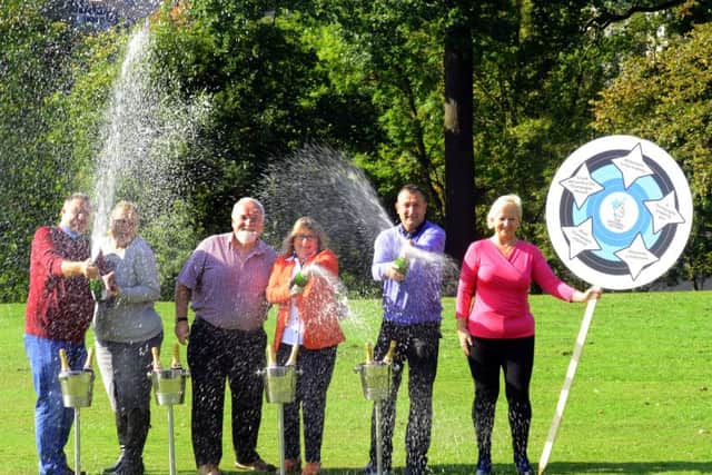 Yorkshire Lottery winners celebrate the 4,000th Lottery millionaire at Roundhay Park in Leeds. L-R: Graham and Amanda Nield from Wakefield, Rob and Elaine Leason from Driffield and  Michael and Susan Crossland from Mirfield. Pictures: Gary Longbottom (GL1007/47b)