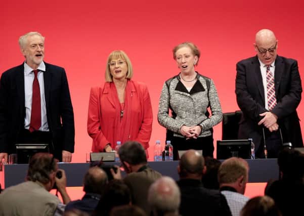 Jeremy Corbyn sings 'The Red Flag'  alongside Diana Holland, Margaret Beckett and Jim Kennedy at the end of the Labour party conference