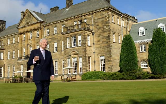 Lord Crathorne whose family owned Crathorne Hall  near Yarm for over 70 years  walks by the hall  and east wing following a £4m restoration.