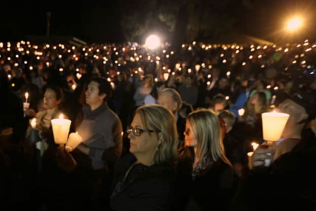 Community members gather for a candlelight vigil for those killed in a shooting at Umpqua Community College in Roseburg, Oregon