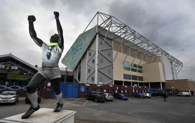 The Billy Bremner statue and the East Stand, Elland Road