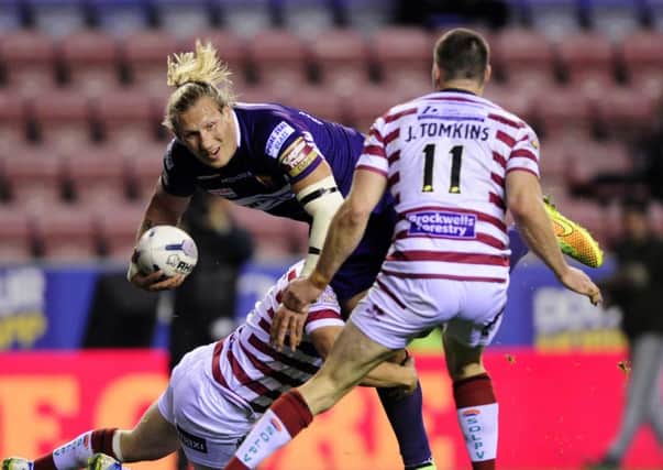Eorl Crabtree looks for support as Sam Powell stops his run and Joel Tomkins closes in. (Picture: Bruce Rollinson)