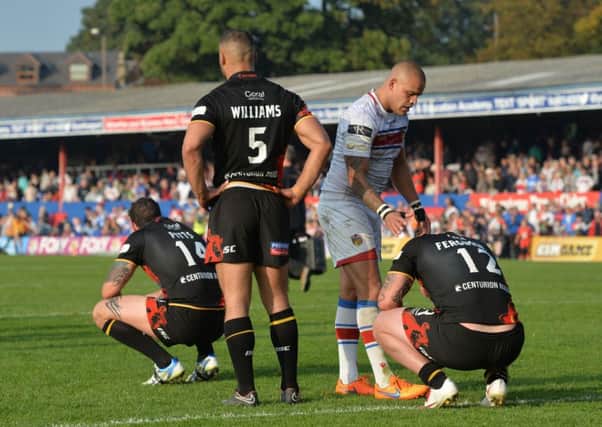 Bradford Bulls players Jay Pitts, Danny Williams and Dale Ferguson are dejected after losing the Million Pound Game.
