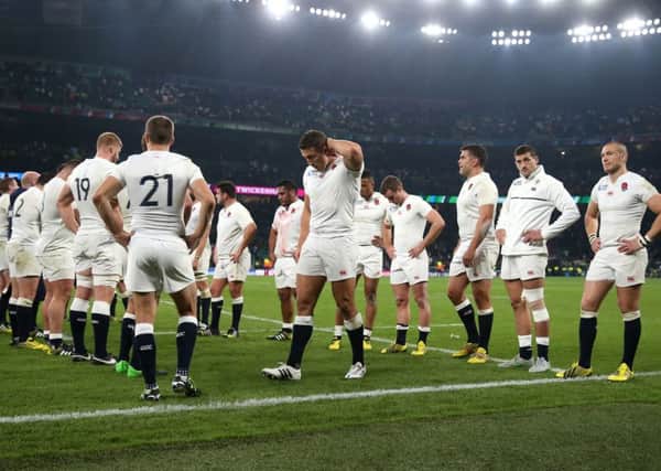 England players stand dejected after the World Cup match at Twickenham Stadium, London.