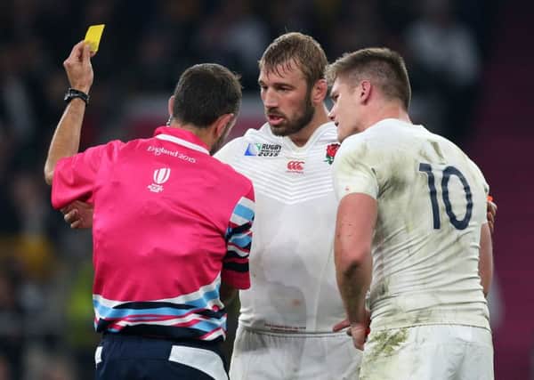 Referee Romain Poite shows the yellow card to England's Owen Farrell (right). (Picture: David Davies/PA Wire).
