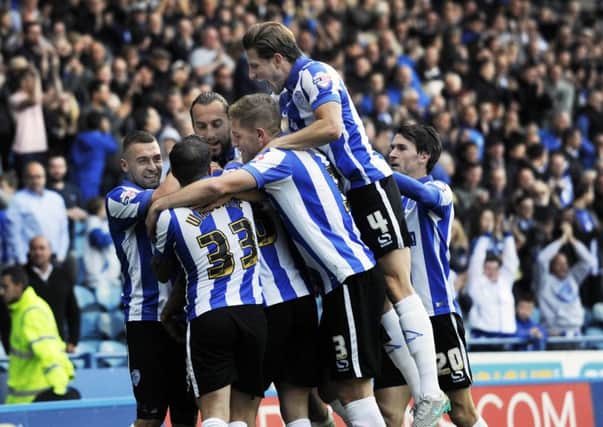 WHAT A DAY: Sheffield Wednesday players mob proud father and goal-scorer Daniel Pudil. Pictures: Steve Ellis.