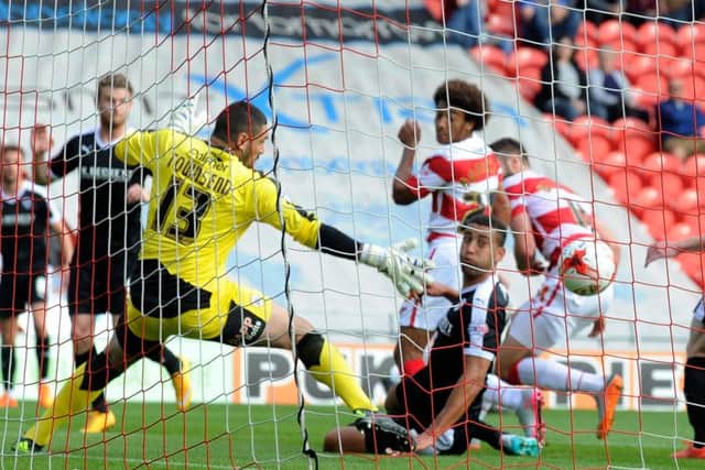Nick Townsend watches as Keshi Anderson's header hits the net for Rovers opener.  Picture: Bruce Rollinson