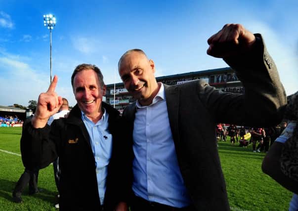 SURVIVORS: Wakefield Wildcats Brian Smith, head coach and club chairman Michael Carter, celebrate their team's win.