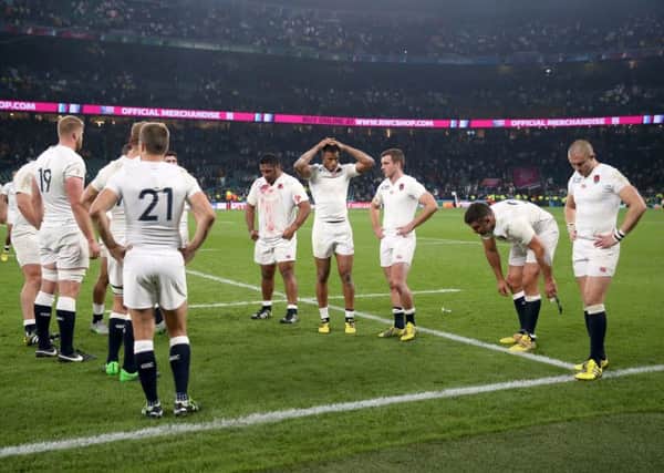 England players stand dejected after their World Cup exit.