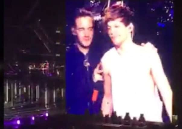 Videograb of what appeared to be an onstage tiff between Liam Payne and Louis Tomlinson during a 1D concert. Picture: SWNS