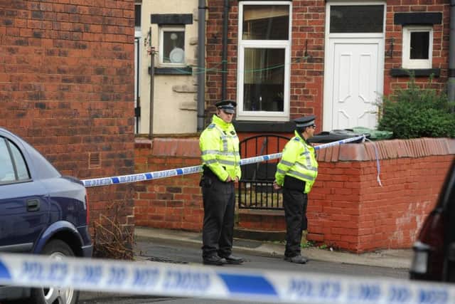 Police at the scene in Moorfield Avenue and Back Moorfield Terrace, Armley, Leeds. Picture: James Hardisty
