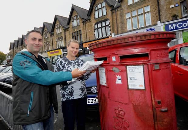 Lucy Clement and Mark Rowlinson post the application for their free school bid. Photo Simon Hulme