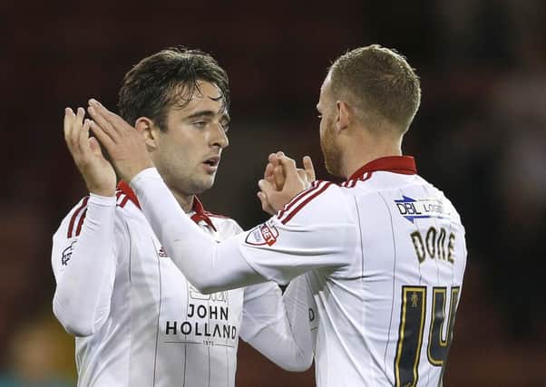 Jose Baxter celebrates scoring his second penalty with Matt Done