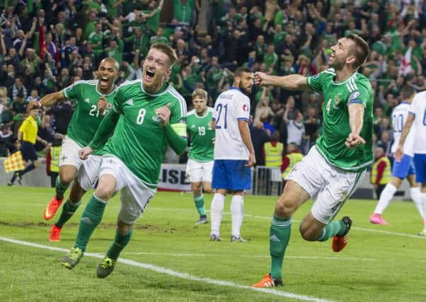 Northern Ireland's Steven Davis (centre) celebrates after scoring his side's third goal of the game against Greece to qualify for next summer's Euro finals. It's their first major tournament since the 1986 World Cup.