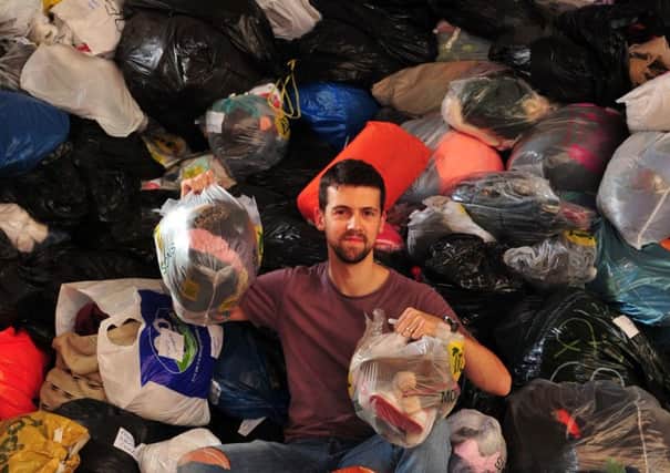 Rev Chris Mitton, curate at St Lukes in Holbeck, is appealling for more volunteers to help the Leeds2Iraq Appeal to sort mountains of donations that will be sent to northern Iraq. 
Picture: Tony Johnson