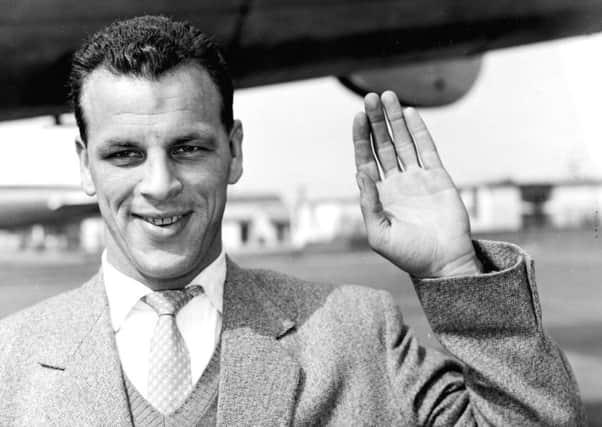 Leeds United's John Charles, waving goodbye as he boarded a plane for Rome at London Airport.
