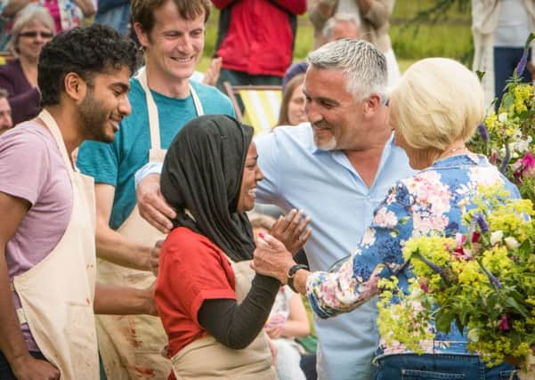 Nadiya Jamir Hussain celebrates with judges Paul Hollywood and Mary Berry. Love Productions/PA Wire