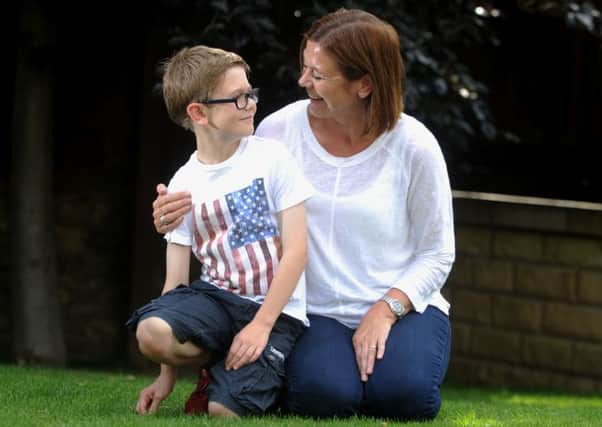 James Hodgson, nine, who had a liver transplant in 2008, with his mum Rachel. Picture by Simon Hulme.