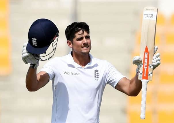 England captain Alastair Cook reacts after reaching a century on the third day of first test match against Pakistan. Picture: AP.