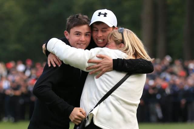 Matt Fitzpatrick is embraced by his brother Alex and mother Sue after his British Masters victory at Woburn (Pictures: Nigel French/PA Wire).