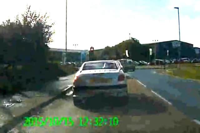 Dashcam video appears to show a police van turning right at a red light
